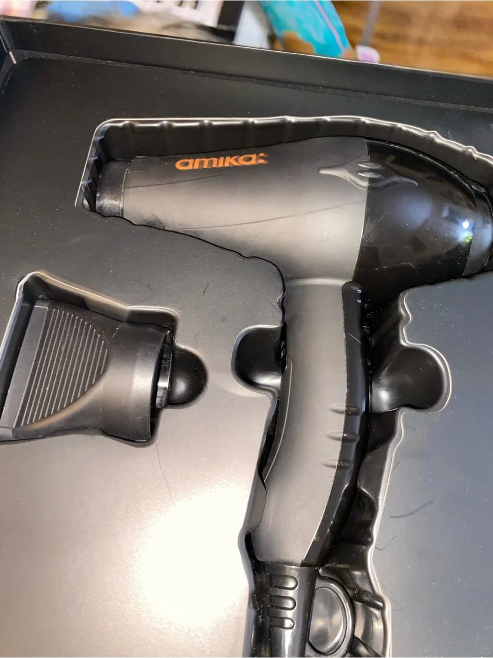 amika Black Professional Hair Dryer with Orange Logo